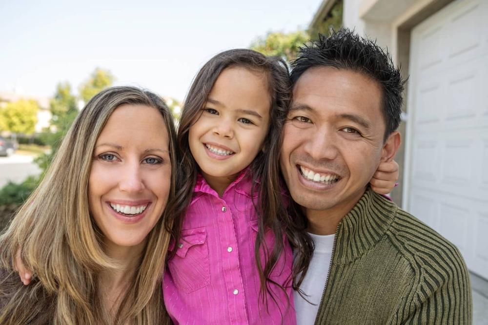 mother, daughter, and father smiling in barrie