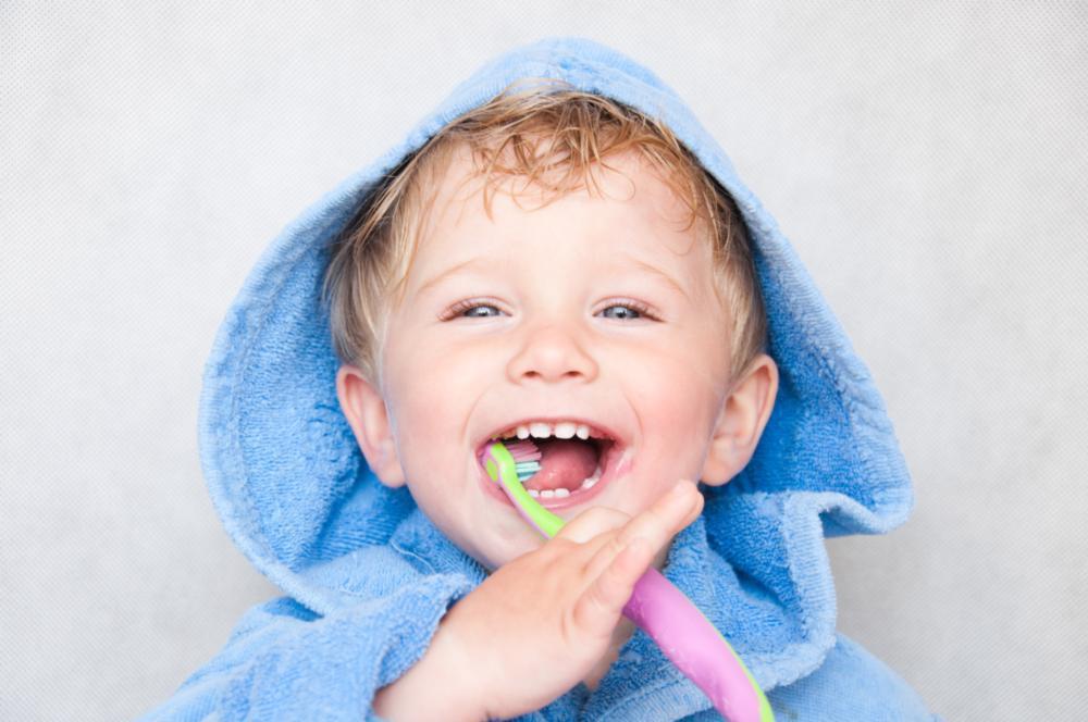 Little boy brushing teeth before going to dental cleaning in barrie