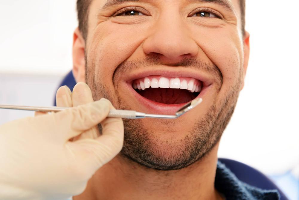 Barrie man smiling during dental exam