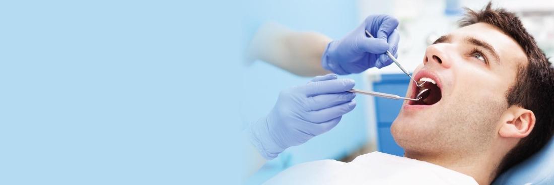 Man getting dental cleaning in Barrie