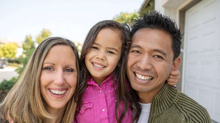 barrie Family of three smiling 