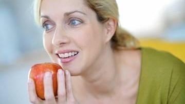 Woman Eating Apple