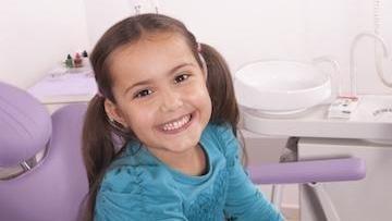 Smiling Child in Dental Chair in Barrie