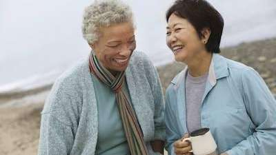 older women laughing on beach in barrie