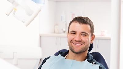 Man sitting in dental chair smiling in barrie