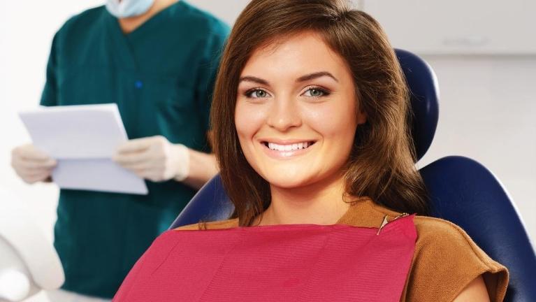 woman sitting in dental chair before dental cleaning in barrie