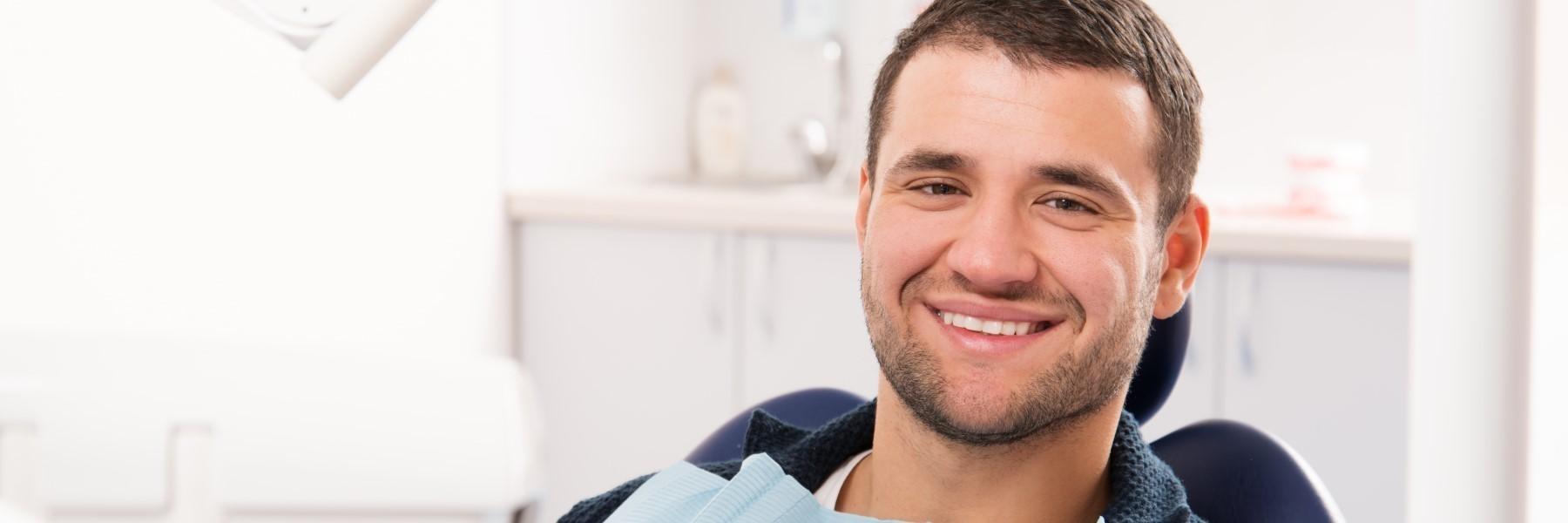 Man smiling in dental chair in Barrie